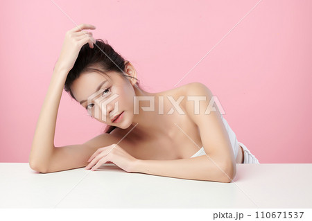 Beautiful young asian woman with clean fresh skin on pink background, Face care, Facial treatment, Cosmetology, beauty and spa, Asian women portrait. Beautiful young asian woman with clean fresh skin on pink background, Face care, Facial treatment, Cosmetology, beauty and spa, Asian women portrait. 110671537