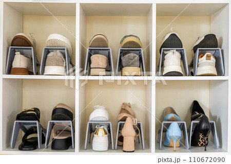 Shoes contemporary storage at home cupboard with shelves cozy room with potted plant interior Shoes contemporary storage at home cupboard with shelves cozy room with potted plant interior 110672090
