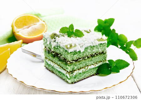 Cake with orange and mint in plate on table 110672306