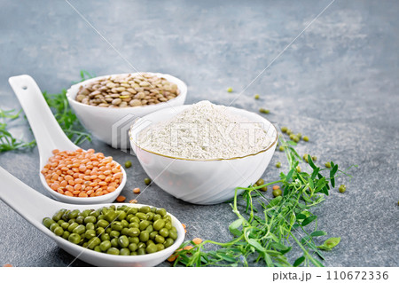 Flour lentil in bowl on stone table 110672336