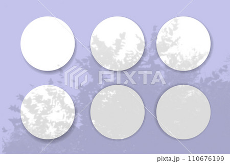 Natural light casts shadows from the plant on 6 round sheets of white textured paper lying on a violet textured background. Mockup 110676199