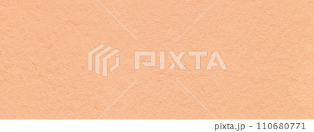 Color of year 2024 peach fuzz. Texture of craft coral paper background, macro. Vintage kraft cardboard. 110680771
