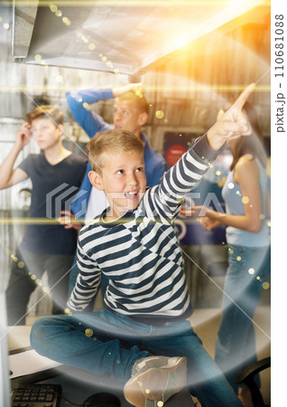 Emotional tween boy pointing at something in quest room 110681088
