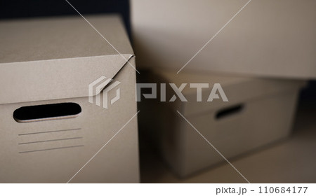 Empty solid cardboard boxes with covers, beige containers to storage things 110684177