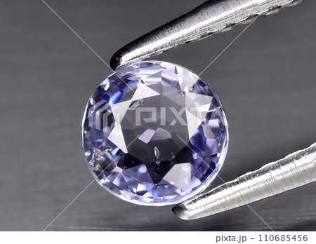 natural blue purple sapphire gem on the background natural blue purple sapphire gem on the background 110685456