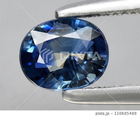 natural blue sapphire gem on the background natural blue sapphire gem on the background 110685489