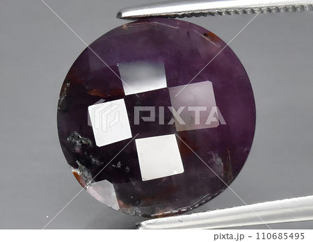 natural purple sapphire gem on the background natural purple sapphire gem on the background 110685495