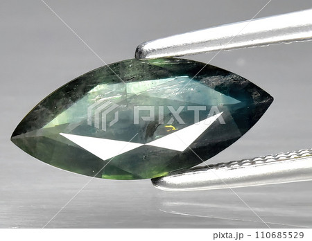 natural green sapphire gem on the background natural green sapphire gem on the background 110685529