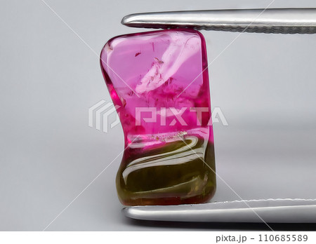 natural bi color watermelon tourmaline gem on the background 110685589