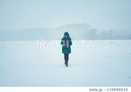 A girl in a red hat, looks at the sky, indicates the direction with he A girl in a red hat, looks at the sky, indicates the direction with he 110686610