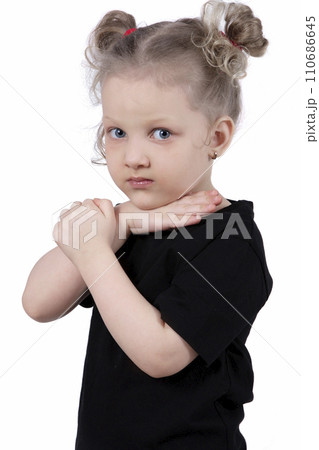 Little girl in a black t-shirt on a white background. Four year old child. Little girl in a black t-shirt on a white background. Four year old child. 110686645