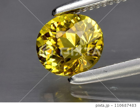 natural yellow grossular gem on the background natural yellow grossular gem on the background 110687483