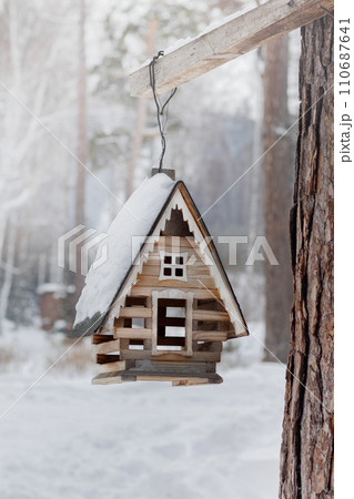 Winter bird feeder house close up photo Winter bird feeder house close up photo 110687641
