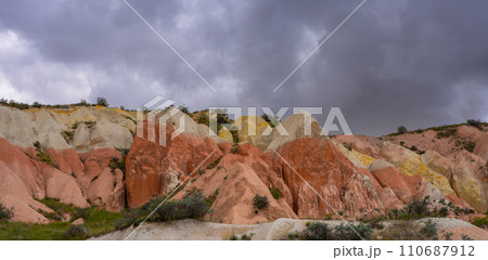 Martian landscape in Cappadocia, unique relief of mountains painted in yellow and pink colors 110687912