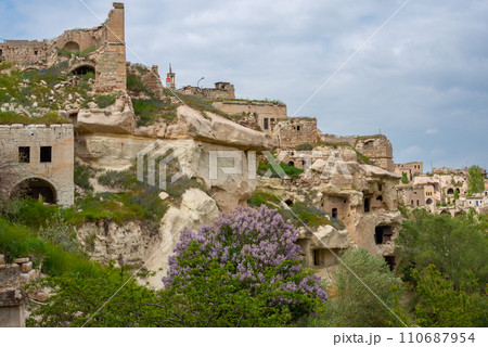 Rock sandstone wall of an ancient house of Cappadocia. Beautiful texture of the wall of an ancient cave dwelling. 110687954