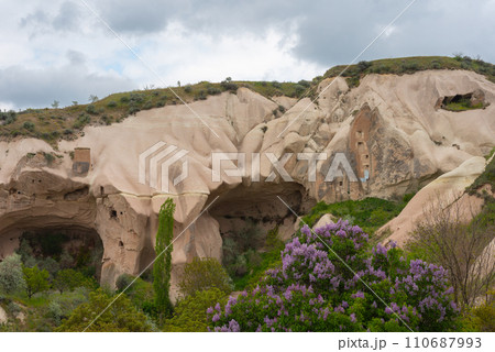 Rock sandstone wall of an ancient house of Cappadocia. Beautiful texture of the wall of an ancient cave dwelling. 110687993