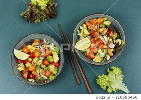 Vegetable salad with seafood. 110690460