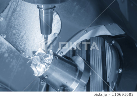 The 5-axis CNC milling machine cutting the turbocharger part with solid ball end mill tool. The 5-axis CNC milling machine cutting the turbocharger part with solid ball end mill tool. 110691685