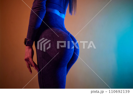 Close-up of a woman doing deadlift exercise alone at the gym. 110692139