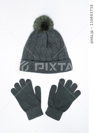 Warm knitted hat and gloves mittens for children on white background isolate on white background Warm knitted hat and gloves mittens for children on white background isolate on white background 110693738