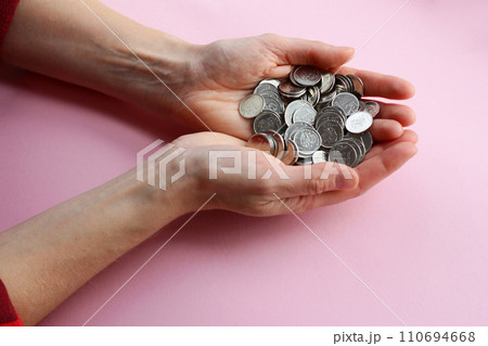 a lot of coins in the hands, russian ruble, counting money, economy concept, allocation of money, wealth 110694668