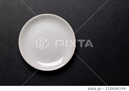 Mockup for a delicious meal. Empty plate on a table Mockup for a delicious meal. Empty plate on a table 110696144