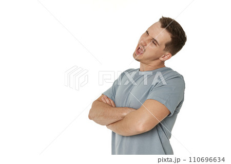 portrait of young happy man winking looking at the camera on white background portrait of young happy man winking looking at the camera on white background 110696634