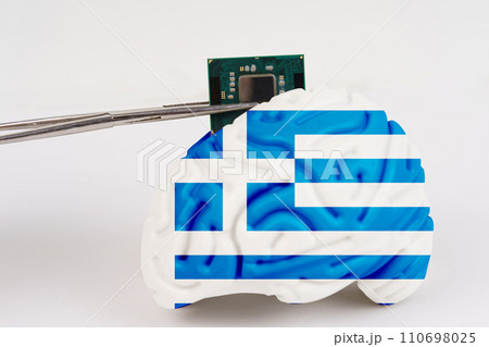 On a white background, a model of the brain with a picture of a flag - Greece, a microcircuit, a processor, is implanted into it. On a white background, a model of the brain with a picture of a flag - Greece, a microcircuit, a processor, is implanted into it. 110698025