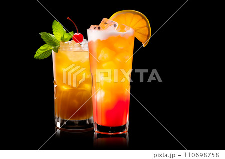 AI-generated content. Set of a vibrant Tequila Sunrise cocktail beautifully showcases layers of tequila, orange juice, and grenadine served in a classic cocktail glass on black background 110698758