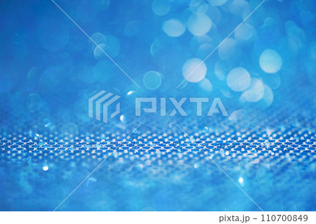 Blue abstract background of glitter paper. Mixed background defocus and thin focus part. Blue abstract background of glitter paper. Mixed background defocus and thin focus part. 110700849