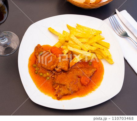 Beef stew served with stewed vegetables 110703468