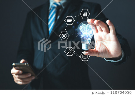 person hand holding a power lightbulb and pretending to think, inspiration, creativity, and imagination concept, innovation technology success business. Digital transformation. Ai technology. person hand holding a power lightbulb and pretending to think, inspiration, creativity, and imagination concept, innovation technology success business. Digital transformation. Ai technology. 110704050