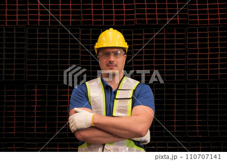 Portrait of Engineer with hardhat safetyglass protective suit. Portrait of Engineer with hardhat safetyglass protective suit. 110707141