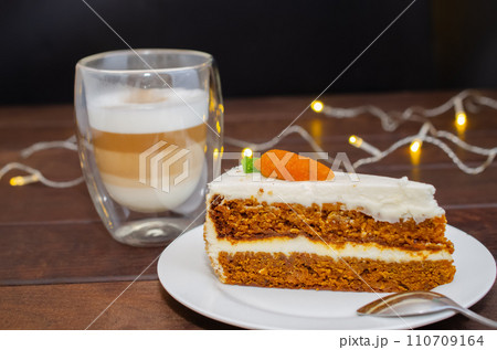 Carrot sponge cake with cream and walnuts and Cappuccino coffee Carrot sponge cake with cream and walnuts and Cappuccino coffee 110709164