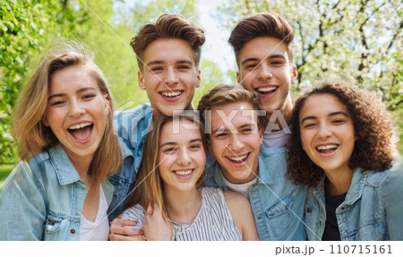 group of smiling young students gathered outside college campus. Happy friends group enjoying spring break together. student friends, celebrating end of classes, taking photo together group of smiling young students gathered outside college campus. Happy friends group enjoying spring break together. student friends, celebrating end of classes, taking photo together 110715161