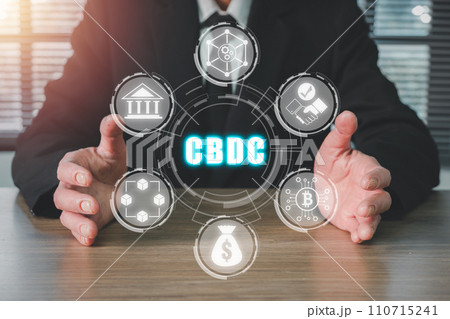 CBDC, Central Bank Digital Currency concept, Businessman hand holding Central Bank Digital Currency icon on virtual screen. CBDC, Central Bank Digital Currency concept, Businessman hand holding Central Bank Digital Currency icon on virtual screen. 110715241