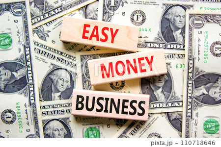 Easy money business symbol. Concept words Easy money business on beautiful wooden blocks. Dollar bills. Beautiful dollar bills background. Easy money business concept. Copy space. Easy money business symbol. Concept words Easy money business on beautiful wooden blocks. Dollar bills. Beautiful dollar bills background. Easy money business concept. Copy space. 110718646