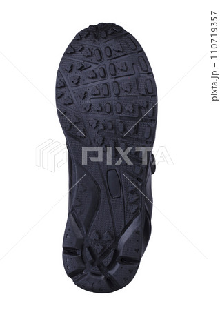 Black fluted shoe sole on a white background. 110719357