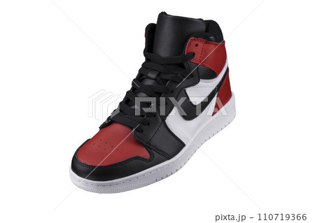 Side view of a high sneaker with red and black accents. Side view of a high sneaker with red and black accents. 110719366
