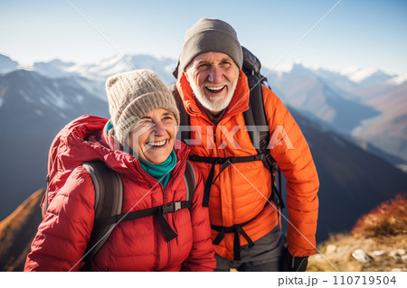 Elderly couple enjoying mountain climbing. AI content 110719504