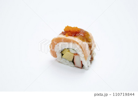 Roll made of salmon maki on white background. 110719844