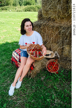 Portrait of Smiling Woman with Basket of Strawberries Portrait of Smiling Woman with Basket of Strawberries 110721614