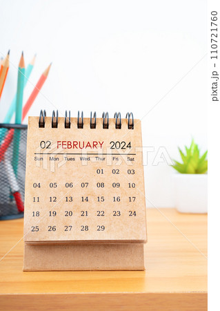 February 2024 Desk Calendar with wooden pencil. 110721760