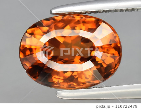 natural orange zircon gem on the background natural orange zircon gem on the background 110722479