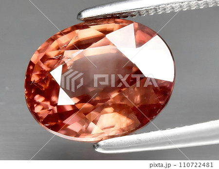natural orange zircon gem on the background natural orange zircon gem on the background 110722481
