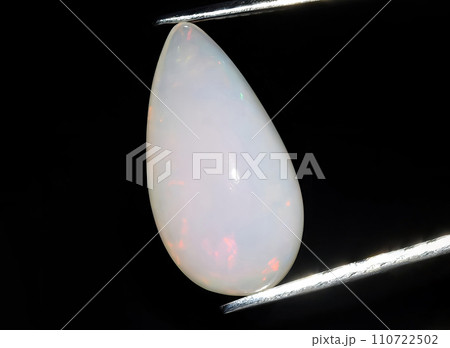 natural multi color rainbow opal gem on the background 110722502