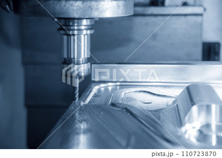 The CNC milling machine cutting press die part by solid bull end mill tool and G-code data background. The CNC milling machine cutting press die part by solid bull end mill tool and G-code data background. 110723870