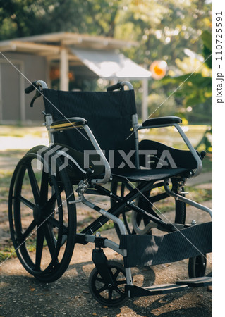 Single wheelchair parked in hospital hallway 110725591