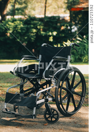 Single wheelchair parked in hospital hallway 110725592