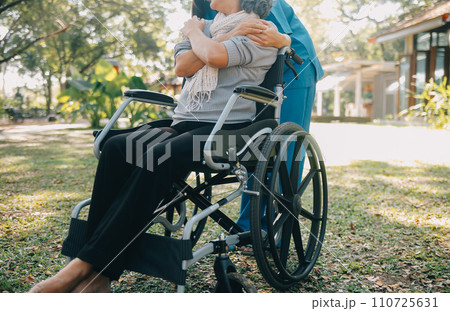 Young asian caretaker with 60s asia elderly woman consulting and encourage, take a history and recommend the right treatment to live happily in retirement, holding hands and encouraging 110725631
